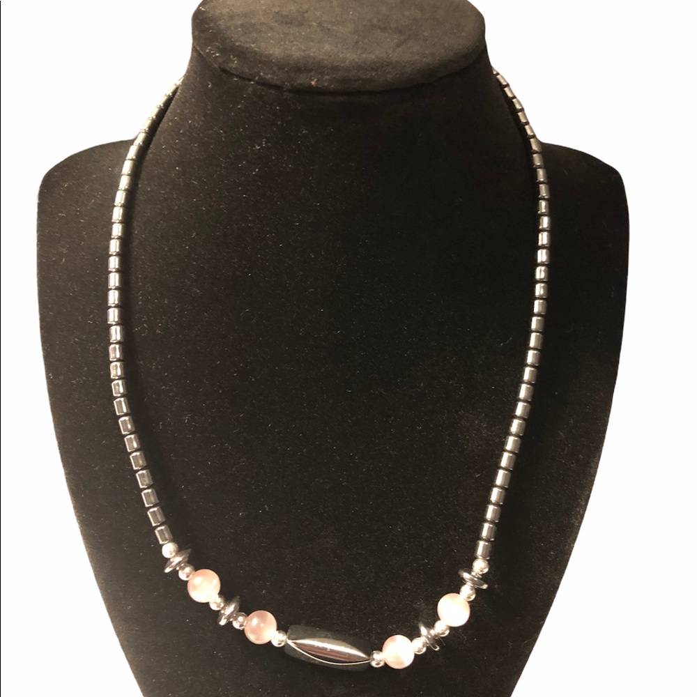 Hematite necklace with light purple beads.